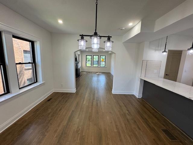3512 Woodside Ave, Brookfield, IL 60513 - unfurnished dining area featuring dark wood finished floors and recessed lighting