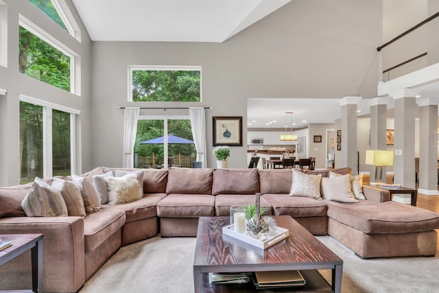 7509 Bittersweet Dr, Gurnee, IL 60031 - living room with high vaulted ceiling, healthy amount of natural light, light colored carpet, recessed lighting, and ornate columns