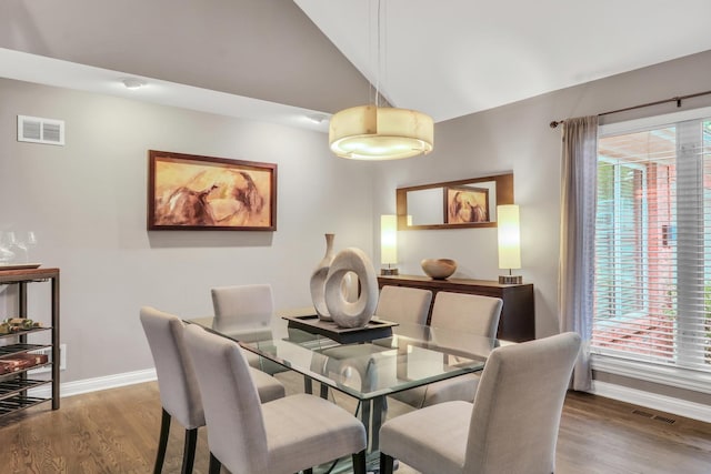 7509 Bittersweet Dr, Gurnee, IL 60031 - dining space with wood finished floors and vaulted ceiling