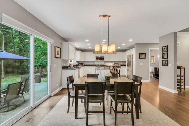 7509 Bittersweet Dr, Gurnee, IL 60031 - dining area with light wood-type flooring and recessed lighting