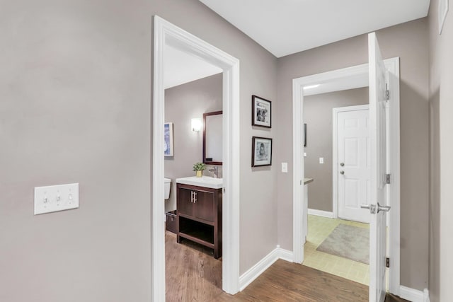 7509 Bittersweet Dr, Gurnee, IL 60031 - corridor with baseboards and wood finished floors