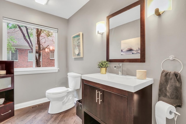7509 Bittersweet Dr, Gurnee, IL 60031 - half bath with vanity and wood finished floors