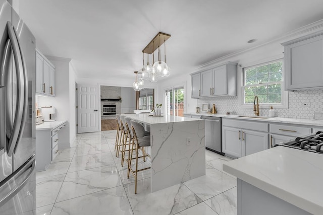 2011 Gleneagle Dr, Plainfield, IL 60586 - kitchen featuring appliances with stainless steel finishes, light marble finish flooring, crown molding, a breakfast bar area, and decorative backsplash