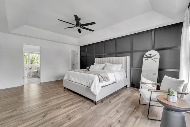 2011 Gleneagle Dr, Plainfield, IL 60586 - bedroom featuring a raised ceiling, light wood finished floors, connected bathroom, and ceiling fan