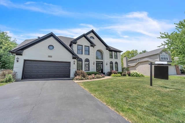 2011 Gleneagle Dr, Plainfield, IL 60586 - french provincial home featuring driveway, an attached garage, and a front yard