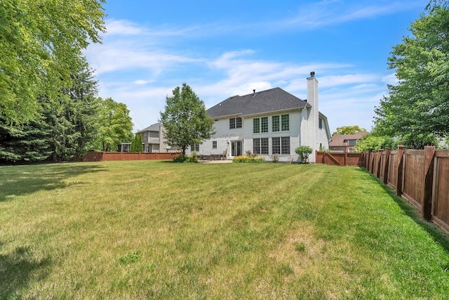 2011 Gleneagle Dr, Plainfield, IL 60586 - back of house with a chimney and a fenced backyard