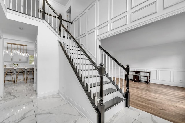 2011 Gleneagle Dr, Plainfield, IL 60586 - stairs featuring marble look tiles and ornamental molding
