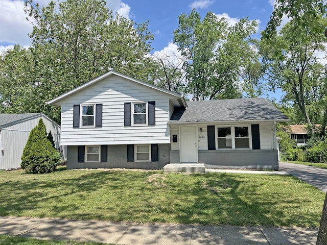 4240 Greenbrier Ln, Richton Park, IL 60471 - split level home featuring a front yard, brick siding, and roof with shingles