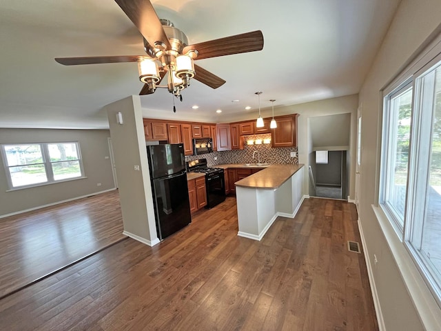 4240 Greenbrier Ln, Richton Park, IL 60471 - kitchen with black appliances, brown cabinetry, backsplash, a ceiling fan, and recessed lighting