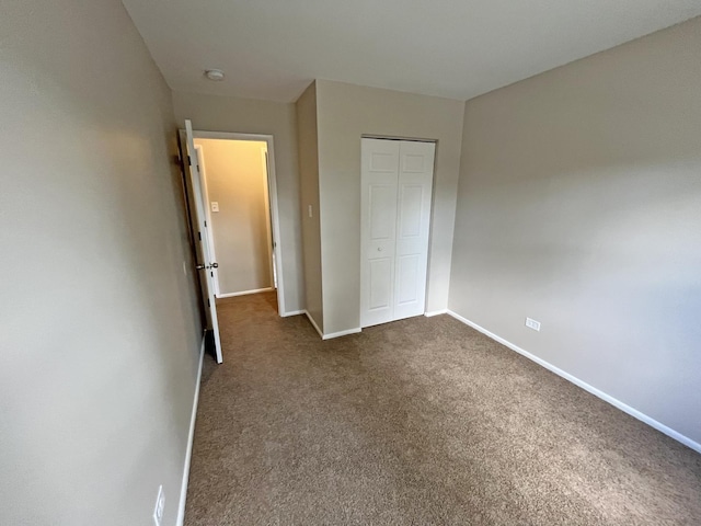 4240 Greenbrier Ln, Richton Park, IL 60471 - unfurnished bedroom with a closet and dark carpet
