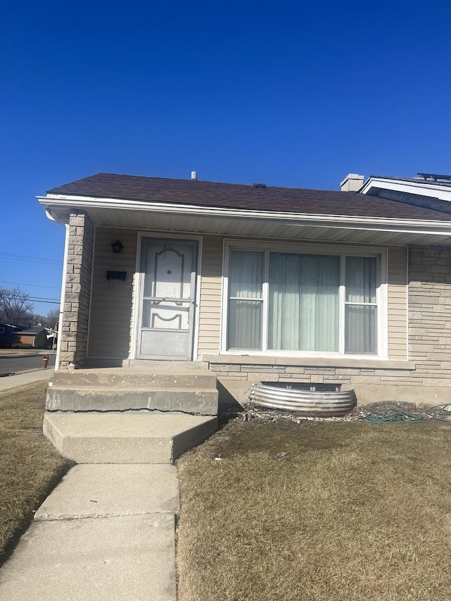1300 E 87th St, Chicago, IL 60619 - view of front facade featuring roof with shingles