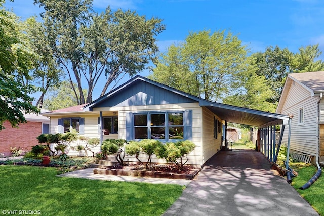 265 N Shaddle Ave, Mundelein, IL 60060 - view of front of home with asphalt driveway, a front lawn, and a carport