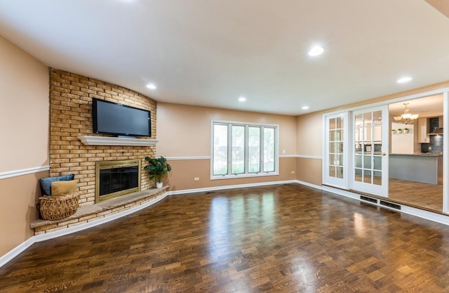 536 S Echo Ln, Palatine, IL 60067 - unfurnished living room featuring a fireplace, a chandelier, recessed lighting, and wood finished floors