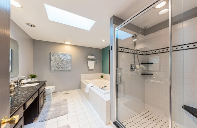 536 S Echo Ln, Palatine, IL 60067 - full bathroom with a bath, vanity, a skylight, a stall shower, and tile patterned floors