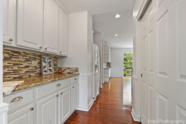 10174 Hopkins St, Huntley, IL 60142 - kitchen featuring dark wood-style flooring, white cabinetry, backsplash, recessed lighting, and white refrigerator with ice dispenser