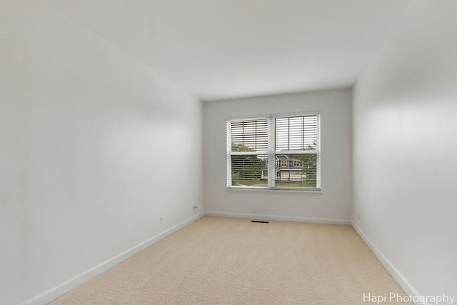 10174 Hopkins St, Huntley, IL 60142 - empty room featuring baseboards and light carpet