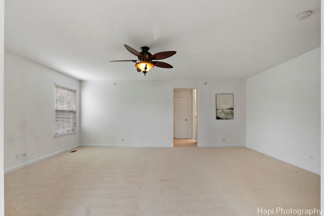 10174 Hopkins St, Huntley, IL 60142 - empty room with a smoke detector, ceiling fan, and light colored carpet