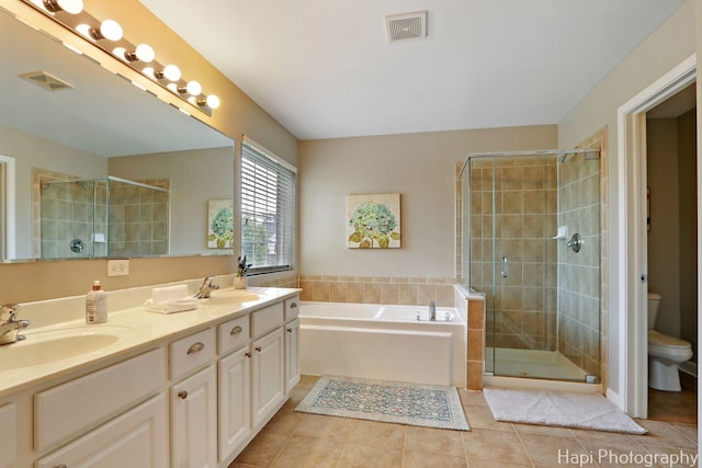 10174 Hopkins St, Huntley, IL 60142 - full bathroom with a shower stall, tile patterned floors, a garden tub, and double vanity