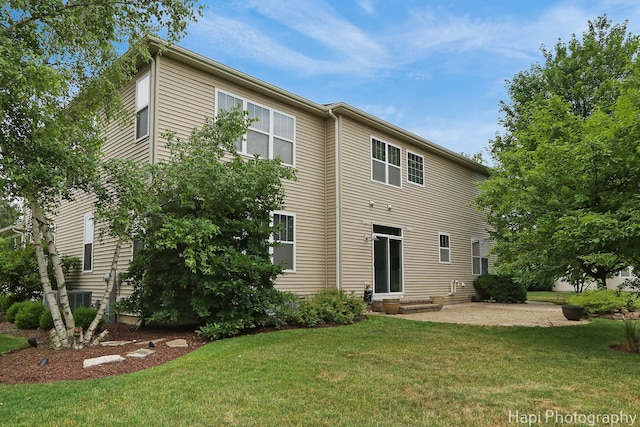 10174 Hopkins St, Huntley, IL 60142 - rear view of property featuring entry steps and a lawn