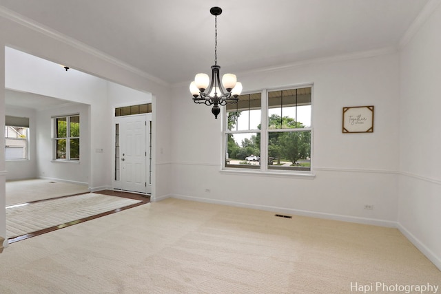 10174 Hopkins St, Huntley, IL 60142 - empty room featuring carpet flooring, ornamental molding, and a chandelier