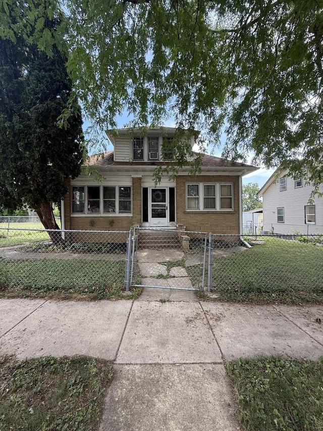 1250 Corbin St, Rockford, IL 61102 - bungalow with a gate and a fenced front yard