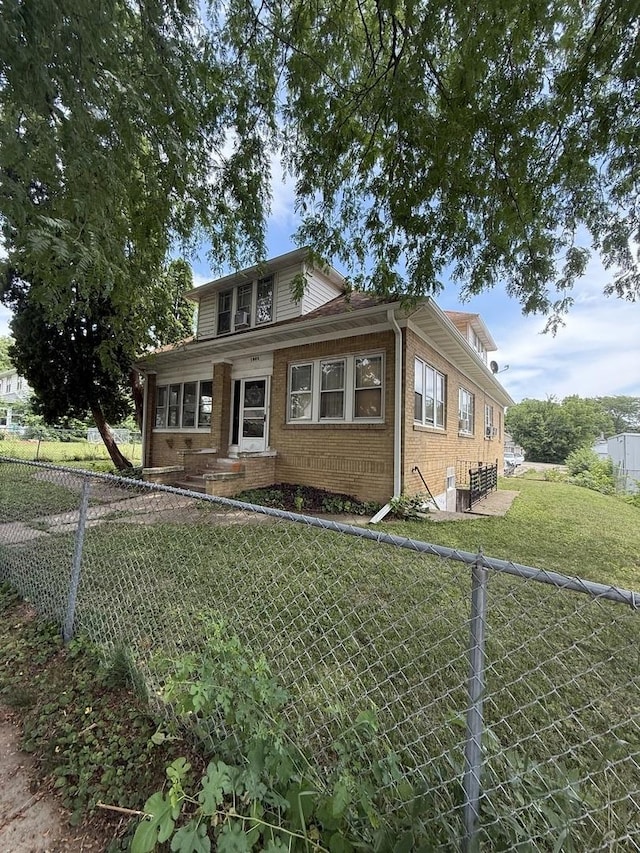 1250 Corbin St, Rockford, IL 61102 - bungalow-style home featuring brick siding and a fenced backyard