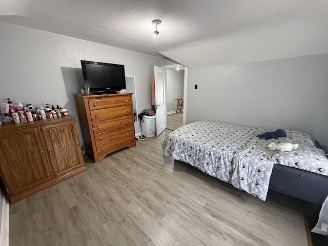 1250 Corbin St, Rockford, IL 61102 - bedroom with light wood-style floors and lofted ceiling