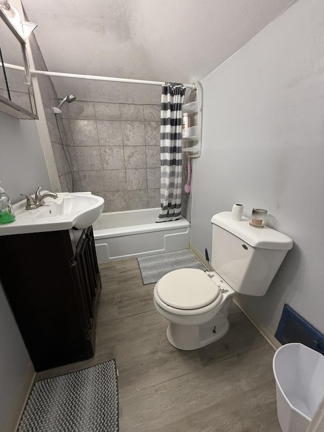 1250 Corbin St, Rockford, IL 61102 - full bath with shower / tub combo with curtain, vanity, and wood finished floors
