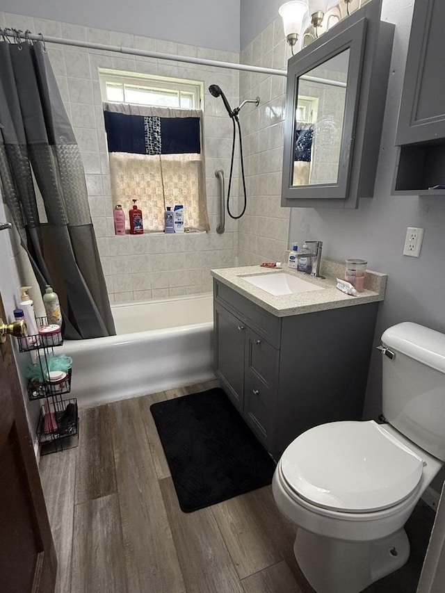1250 Corbin St, Rockford, IL 61102 - full bath featuring shower / bath combo, vanity, and wood finished floors
