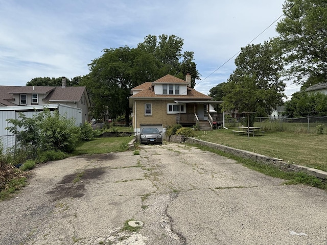 1250 Corbin St, Rockford, IL 61102 - bungalow with driveway, a chimney, a porch, and a garage