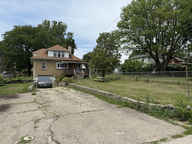 1250 Corbin St, Rockford, IL 61102 - bungalow-style home with a chimney, asphalt driveway, an attached garage, a porch, and brick siding