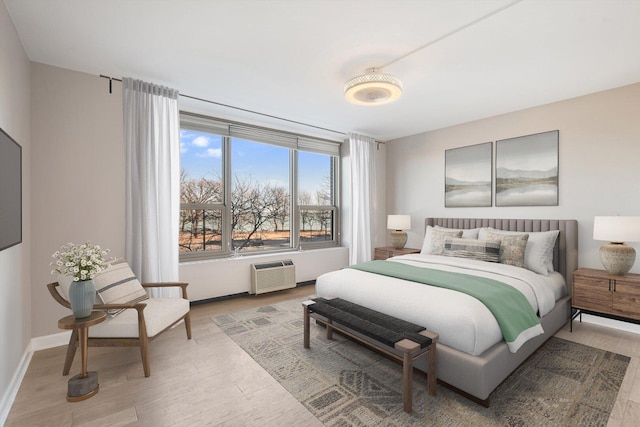 1550 N Lake Shore Dr Unit 2A, Chicago, IL 60610 - bedroom featuring wood finished floors and a wall unit AC