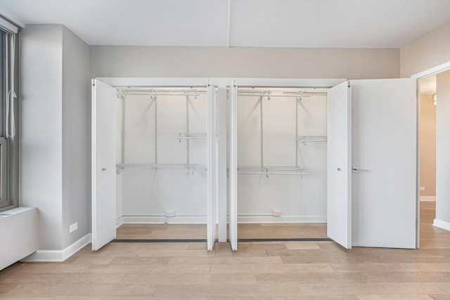 1550 N Lake Shore Dr Unit 2A, Chicago, IL 60610 - unfurnished bedroom featuring two closets and light wood-type flooring