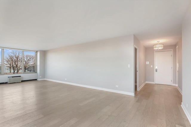 1550 N Lake Shore Dr Unit 2A, Chicago, IL 60610 - unfurnished living room featuring light wood-type flooring and an AC wall unit