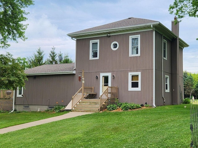4256 W Egan Rd, Leaf River, IL 61047 - view of front of property with a chimney, a front lawn, and a shingled roof