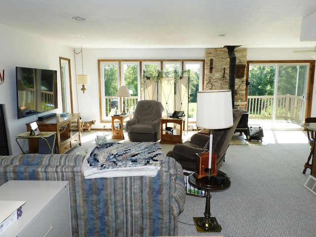 4256 W Egan Rd, Leaf River, IL 61047 - carpeted living area featuring a wood stove