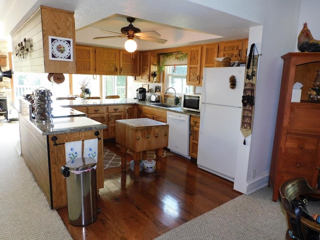 4256 W Egan Rd, Leaf River, IL 61047 - kitchen featuring white appliances, a peninsula, a ceiling fan, dark wood-style floors, and brown cabinetry