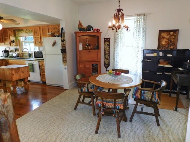4256 W Egan Rd, Leaf River, IL 61047 - dining area featuring a chandelier, wood finished floors, and ceiling fan