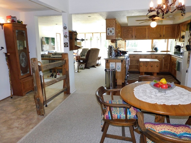 4256 W Egan Rd, Leaf River, IL 61047 - dining space featuring ceiling fan and a chandelier