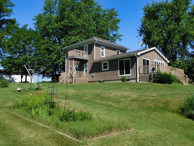 4256 W Egan Rd, Leaf River, IL 61047 - back of house featuring a balcony and a wooden deck