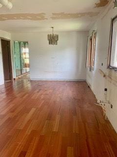 26158 W Reed St, Ingleside, IL 60041 - unfurnished room featuring healthy amount of natural light, a chandelier, and light wood-style floors