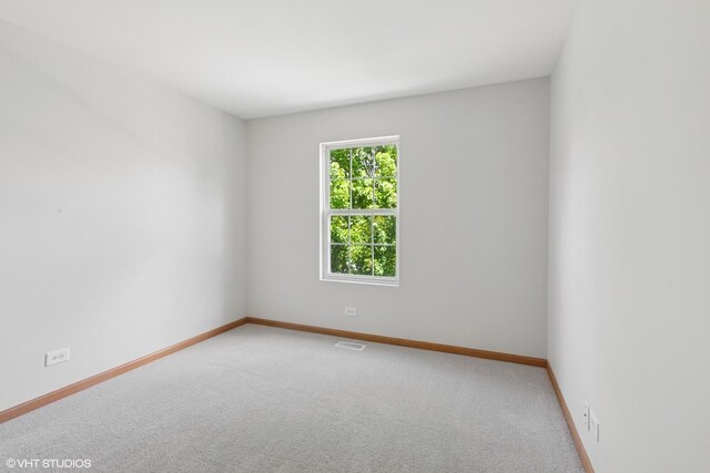 133 Springbrook Trl S, Oswego, IL 60543 - empty room featuring carpet and baseboards