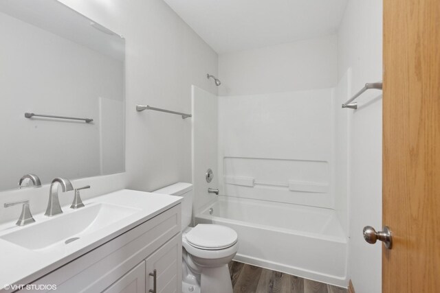 133 Springbrook Trl S, Oswego, IL 60543 - full bathroom with wood finished floors, vanity, and tub / shower combination