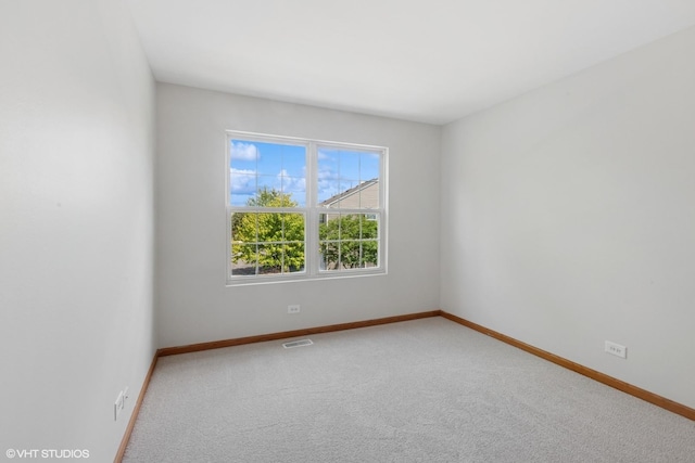 133 Springbrook Trl S, Oswego, IL 60543 - empty room featuring carpet and baseboards