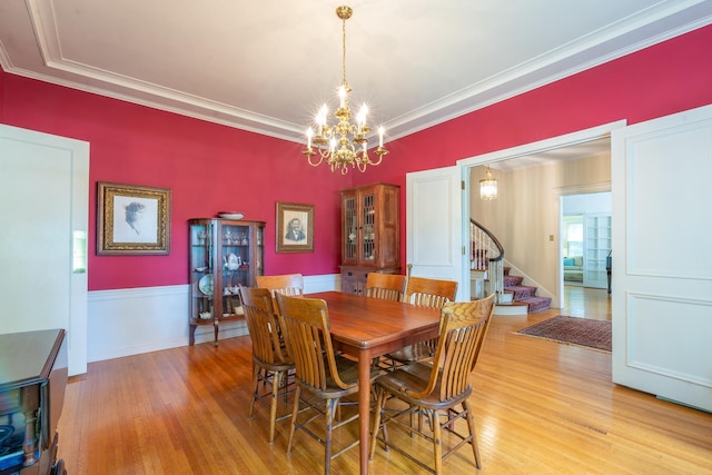 1286 W Stephenson St, Freeport, IL 61032 - dining room with stairway, a chandelier, light wood finished floors, and crown molding