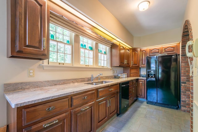 1286 W Stephenson St, Freeport, IL 61032 - kitchen featuring black appliances, light stone countertops, brown cabinets, and light stone finish flooring