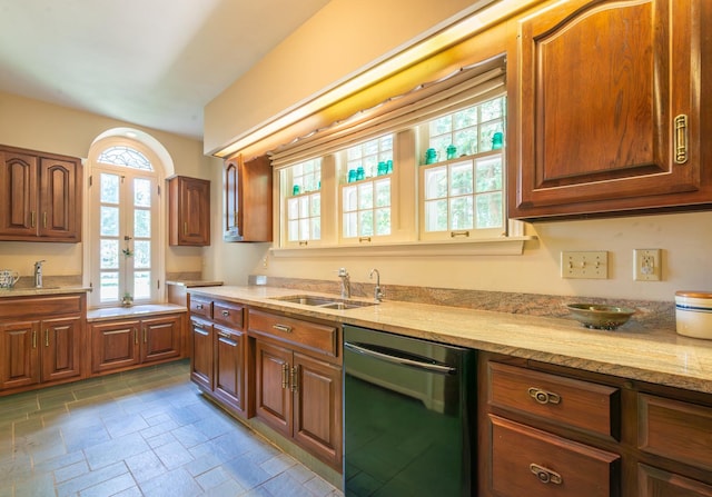 1286 W Stephenson St, Freeport, IL 61032 - kitchen featuring dishwasher, light stone countertops, stone tile floors, brown cabinets, and french doors
