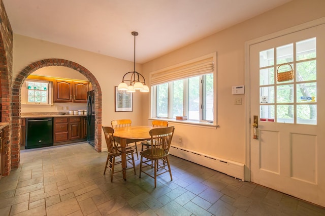 1286 W Stephenson St, Freeport, IL 61032 - dining area with a baseboard radiator, plenty of natural light, and arched walkways