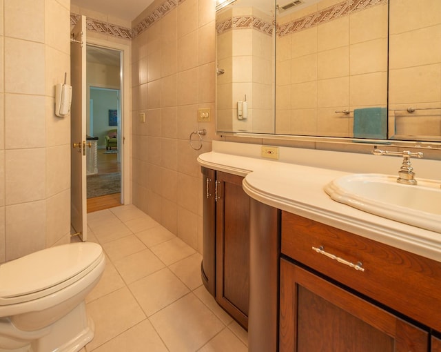 1286 W Stephenson St, Freeport, IL 61032 - bathroom with tile walls, vanity, and tile patterned flooring