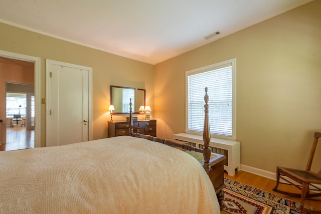 1286 W Stephenson St, Freeport, IL 61032 - bedroom with radiator and wood finished floors